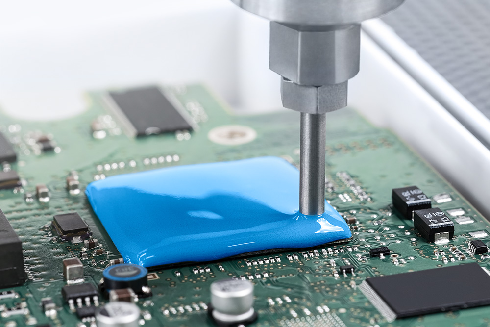 A PU coating is applied for protecting a defined area on a PCB.
